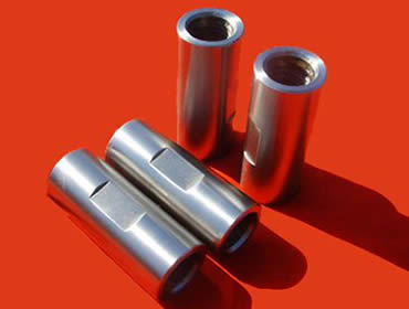 Four sucker rod couplings with wrench square on the coupling body.